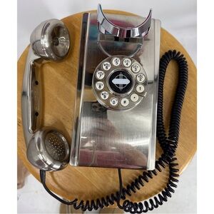 The Crosley Wall Phone Brushed Chrome is a vintage-inspired wall phone
